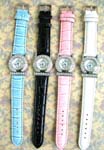 Womens accessory distribution export supplier. Cz rhinestones embedded in circular silver plated frame of watch with colored faux leather strap