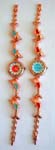 Womens jewelry wholesale exchange supplier imports from China. Stylish gold plated watch chain with colored enamel dolphin designs and circular clock face