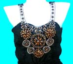 China B2B trade agency supplies fine fashion clothing. Beautiful black Spanish style dress with decoratively beaded top and midi length skirt