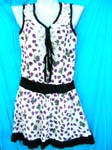 Apparel wholesale warehouse exports Womens dress with purple ladybug print, black edging, lace around tank top collar and frill hem