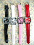 Anniversary gift shopping outlet catalog. Fun fashion watch with heart decor in clock face framed by silver plated circle design and faux leather wrist band