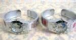 Fun ladies accessory online B2B trade supplier. Bangle bracelet watch with sparkly enamel on side of band and silver plated frame with butterfly design on clock face