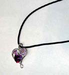 Love jewelry wholesale supplier distributes necklaces to retail outlets. Beautiful heart shape, silver plated pendant with purple cz stoned flowers in top corners and dark purple crystal in bottom center 