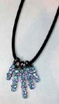 Hip hop wholesale agent supplies necklace to retail shops. Five columned pendant with light blue and purple cz gemstones inlaid in each dangling arm hanging from black cord