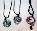 China cz fashion accessory warehouse exports wholesale necklaces. Circular and heart shaped pendant in cut out designs and inlaid with multicolored cz crystals hanging from black beaded necklace