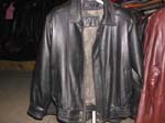 Mens outer wear replica leather coat sale from China import wholesale distributor. Classic mens imitation, black leather jacket with elastic waist, zipper, and buttons on top and bottom