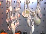 Summer style jewelry store wholesaler supplies China manufactured products. Cream colored beach shells hanging on beaded necklace