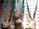 Beaded jewelry craft necklace factory wholesaler distributes beauty gifts. Large circular shell pendant hanging on colored bead and shell necklace