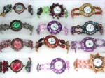 Wholesale fashion jewelry supplier distributes China manufactured watches. Circular watch framed by colored enamel with beads and has beautiful beads along cuff