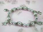 Silver bracelet charms and wholesale gifts from China. Silver pearl beaded stretchy charm bracelet with ducky, rabbit, and basket charms