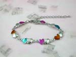 Online China fashion jewelry store supplying unique bracelets. Fashion chain bracelet in heart shaped design with colored enamel and silver plated hearts