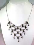 Semi precious stone necklace onloine wholesale store supplies Fashion necklace with five tiers of pearl drop shape black beads and cz stones inlaid in silver chain that are interchanged with heart and cross shape charm
