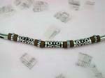 fashion online necklace gifts sold wholesale to retail shop. Silver necklace with solid pole chain attached with brown beads. Center of necklace has three long silver designed beads interconnected with brown beads