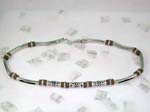 fashion online necklace gifts sold wholesale to retail shop. Silver necklace with solid pole chain attached with brown beads. Center of necklace has three long silver designed beads interconnected with brown beads