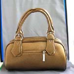 Purse/ handbag wholesale manufacturers exporting fashion accessories from China. Imitation leather shiny brown hand bag with double zipper and belt knot-like design on handle, also zipper top, zipper pocket on back and inside zipper pocket