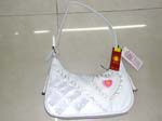 handbag and purse distribution wholesalers supplying products online. Teen fashion purse made from white imitation leather decorated with frills and heart design