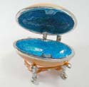 Enamel jewelry box motif an egg shape with blue double heart pattern in yellow color