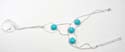 Assorted turquoise slave bracelet motif cut-out tear-drop pattern connected with triple circle design, attaches to the middle finger with a cz ring