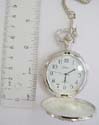fashion pocket watch design in silver color motif double eagle pattern on cover and white clock face design
