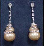 Wholesale fine cz jewely store supplies earrings online. Rain drop earings with clear cz stones inlaid in rhodium plated chain that wraps around simulated mother of pearls.