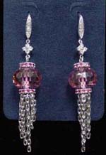 Crafted jewelry store supplies wholesale cz earring fashion. Plated rhodium danglers hanging from large pink cz stone that connects to flower motif just below stud