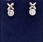 wholesale imitation diamond earrings distributed for discount price online. Rhodium plated studs holding circular cz stone.