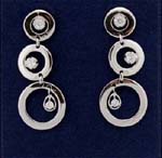 Wholesale fashion jewelry manufacturers and supply business. Fashionable three tiered hooped earings with cz stone in each loop.