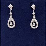 Quality style cz jewelry sold online wholesale to retail shops. Cz stones hanging in center of oval shaped hoops that are held by cz chrystal studs.
