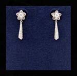 Gemstone fashion factory impoters distribute cz earrings wholesale. Flower studs with cz stone as center and rhodium plated poles hanging below
