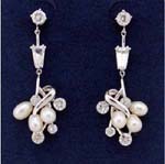 Women fashion jewelry at wholesale price from online gift store. Imitation pearl and cz stone cluster suspended beneath a rectangle and a circular shaped clear cz chrystal