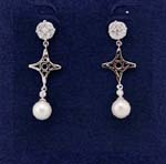 Outsourcing dealer with China products wholesales women cz earrings. Simulated diamond studs hold rhodium plated cross shapes with imitation pearls hanging below