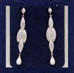 Experience women jewelry direct wholesalers supplies cz earrings online. Four rhodium plated leaves hanging loosely with imitation pearl at bottom