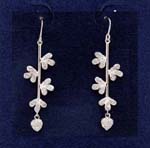 Beautiful jewelry wholesaler supplies women fashion accessories. Threader earings have heart shaped cz stones at tips and are suspended by rhodium plated poles with three leaf clovers attached