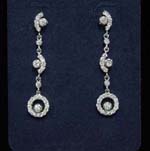 Fashion cz jewelry distributed by China import wholesaler. Entirely made with clear cz stones the double arc with chrystal in center creates the chain that suspends a hollow circle with another gem held in center