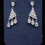 Wholesale mothers day gift fashions supplied online from import dealer. Triangle design created from clear cz stones with three clear cz chrystals hanging below and one as stud.