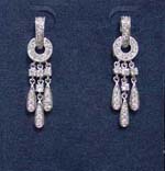 Handmade cz jewelry from China supplied wholesale for retail sale. Elegant looking rhodium plated thick circles hold three rows of cz stones and rain drop design.
