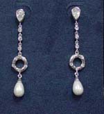 Jewelry shop distribution business sells wholesale cz earrings and accessories. Elegant earings have oval shaped cz stone in stud which suspends a rhodium plated chain forming into a circle that holds a tear drop shaped imitation pearl