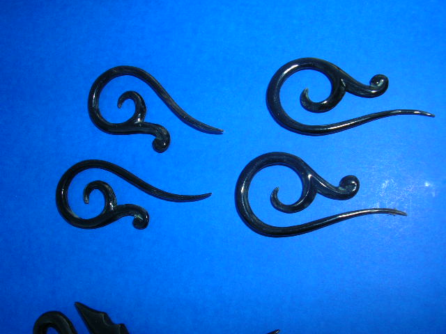 Vine tip on elongated spiral motif horn earrings, handcrafted organic jewelry from indonesia - warehouse supplier
