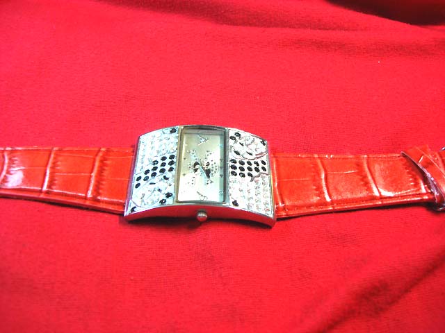 Imitation red leather strap on black and clear gemstone thick framed watch shopping catalog