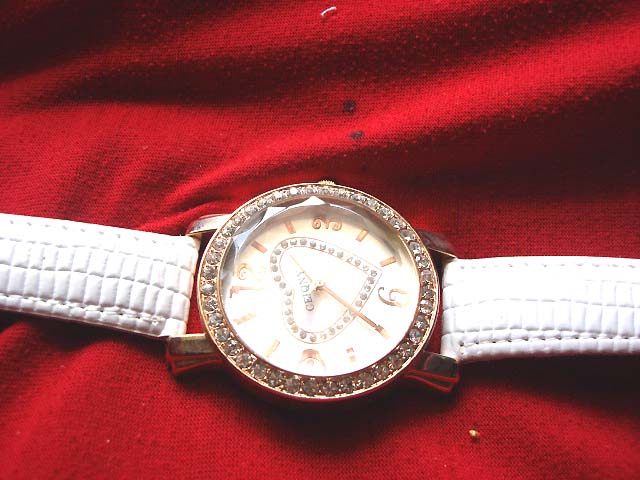 Fine heart image on clock face of stylish watch with white strap - Wholesale import trader