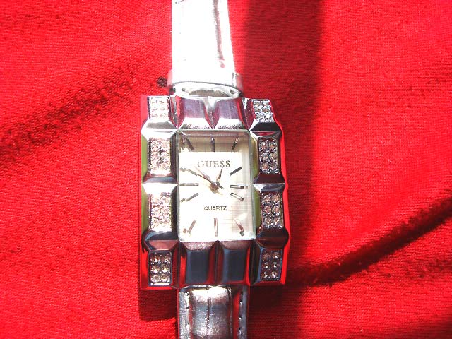 B2b jewelery source - Spring Guess designed ladies evening watch with pink tinted strap and rectangle shaped clock frame