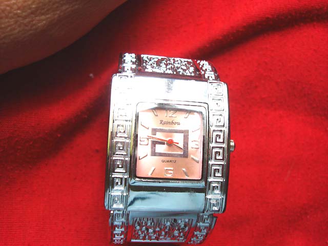 Spiral design along sides on silver framed bangle bracelet watch - ladies jewelry shopping market