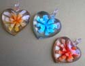 Glass flower pendant in heart shape design