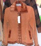 Orange color lady's imitation leather long coat; faux fur lined along at bottom;neck and zipper part; two pocket; zipper-up front closure 