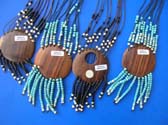 Round wooden pendant with mini beaded string hanging bellow and beaded necklace