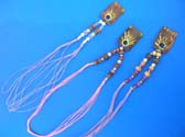 Balinese painted art design on rectangular wood pendant hanging from multi cord necklace with an assortment of beads