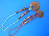 Large circular wooden pendant on mini and wood bead necklace