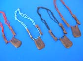 Wood pendant in rectangle shape on balinese beaded necklace with two arrow shaped, wooden beads