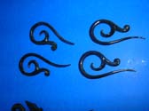 Vine tip on elongated spiral motif horn earrings, handcrafted organic jewelry from indonesia