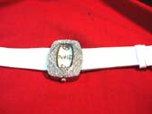 Stylish ladies white strap watch with beauty gems inlaid in large frame